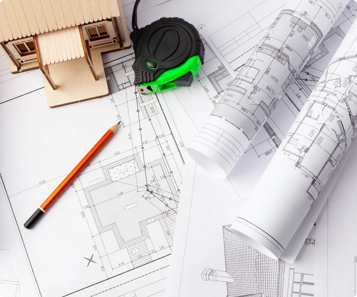 Model house on top of construction plans
